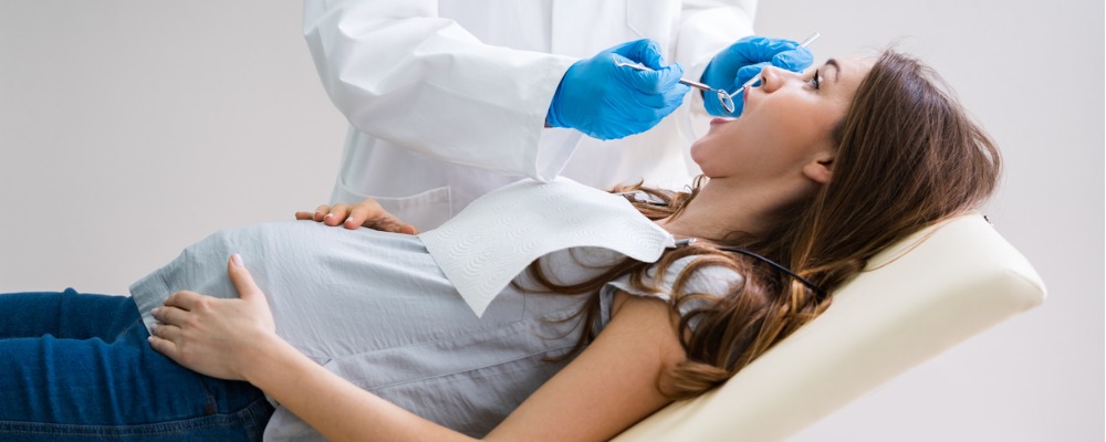 Pregnant woman during a routine preventive dental visit